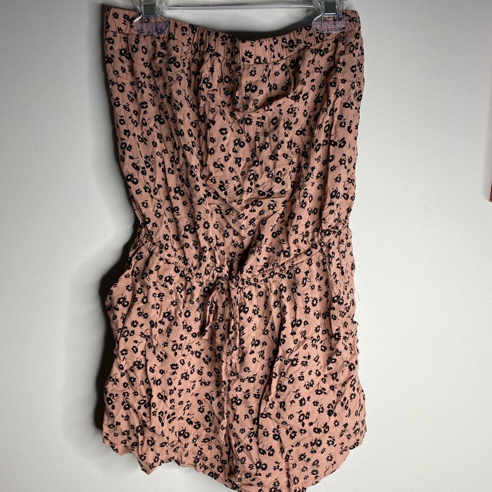 Pink romper with flower design
